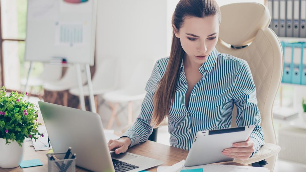 Portrait of serious young businesswoman accountant in formal wea