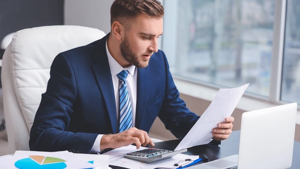 Male accountant working in office